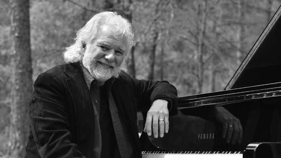 Chuck Leavell at a piano 