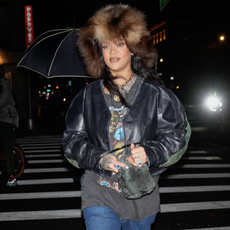 Rihanna is seen on December 29, 2024 in New York City wearing a fur hat and bottega veneta boots