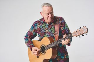 Tommy Emmanuel, pictured with one of his signature Maton guitars