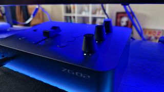 Yamaha ZG02's volume faders under blue RGB lighting