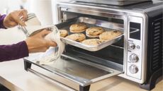 Toaster oven vs countertop oven: a tray of cookies coming out of a toaster oven