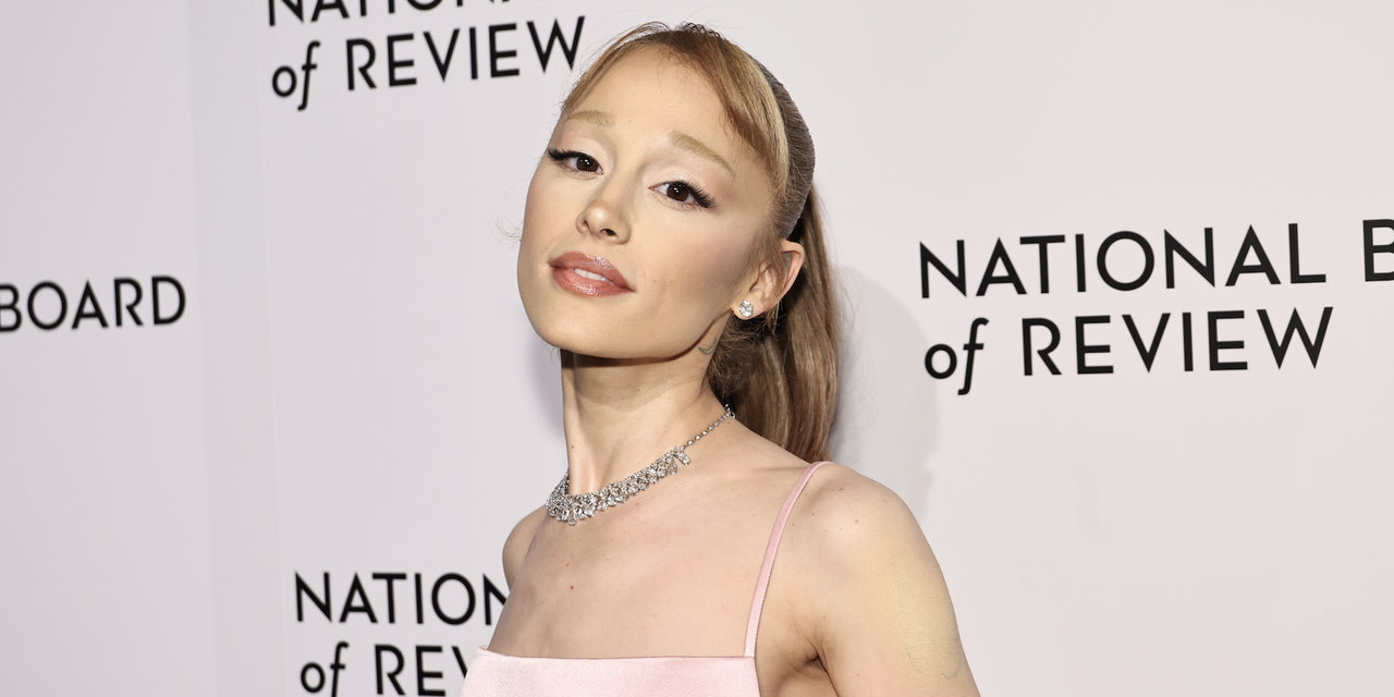 Ariana Grande attends the 2025 National Board of Review Gala at Cipriani 42nd Street on January 07, 2025 in New York City with ethan slater wearing a pink blackess dress and a beaded loewe squeeze bag