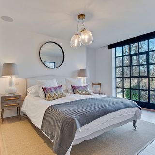bedroom with ceiling crittall windows and mat
