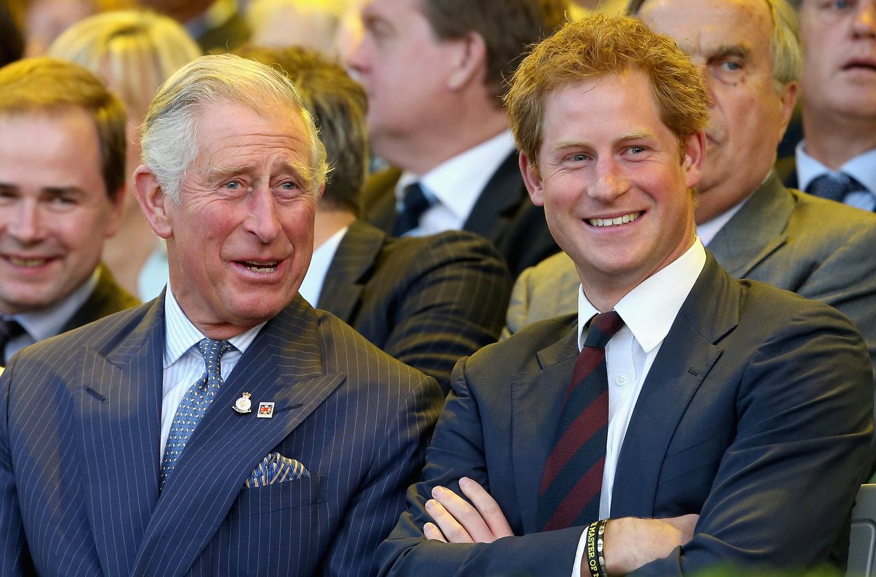 LONDON, ENGLAND - SEPTEMBER 10: Prince Charles, Prince of Wales and Prince Harry laugh during the Invictus Games Opening Ceremony on September 10, 2014 in London, England. The International sports event for &#039;wounded warriors&#039;, presented by Jaguar Land Rover, is just days away with limited last-minute tickets available at www.invictusgames.org (Photo by Chris Jackson/Getty Images)