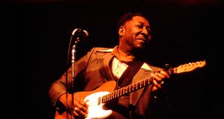 Muddy Waters with his iconic red Fender Telecaster
