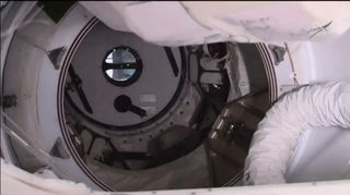Astronauts on board the International Space Station closed the hatch of the first Crew Dragon capsule to visit the orbiting laboratory on March 7, 2019.