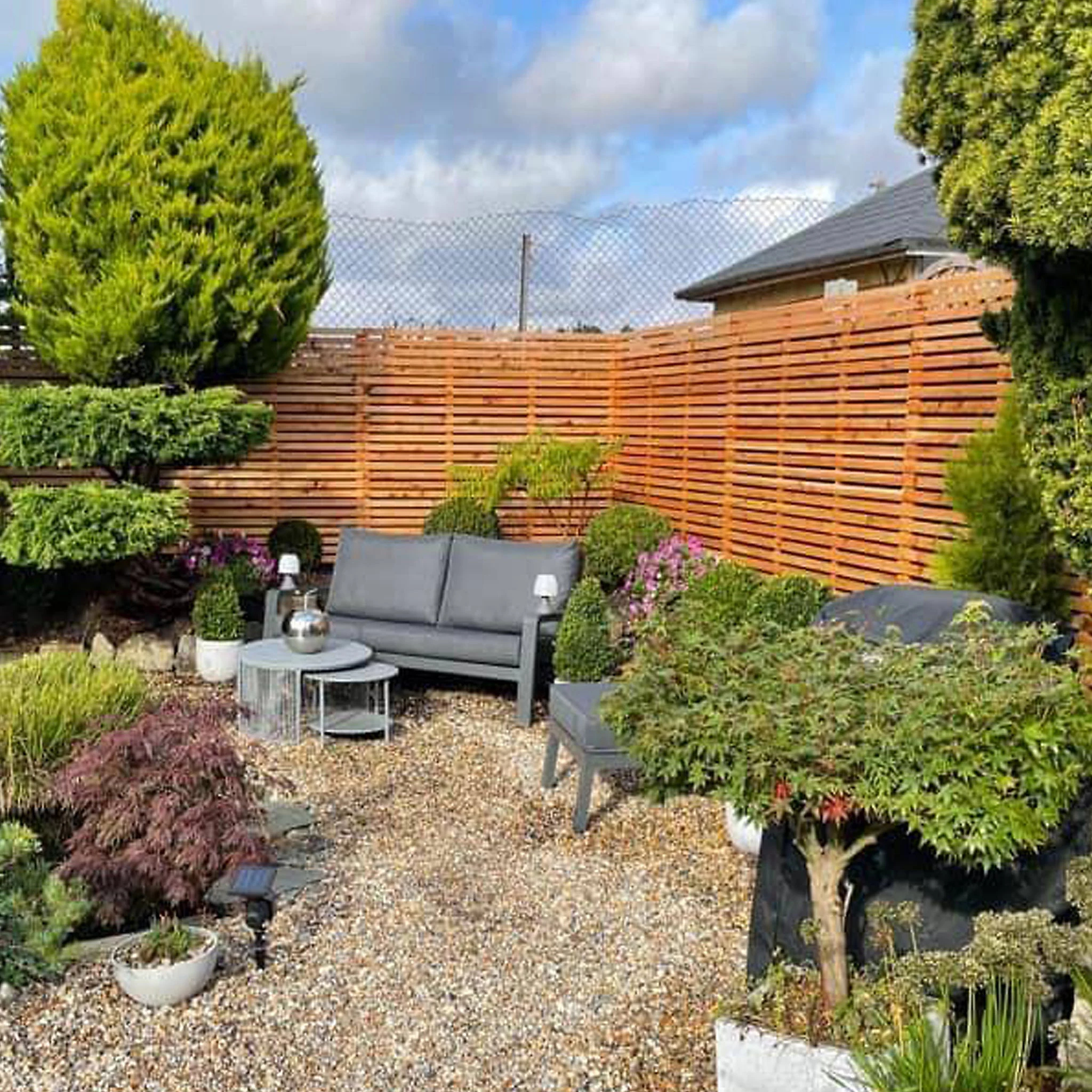 cedar narrow slatted fence panels in garden