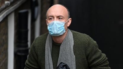 Dominic Cummings leaves his residence in London wearing a face mask.