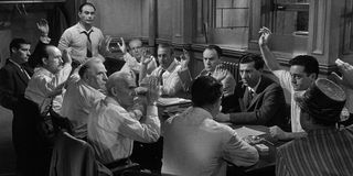 The room of jurors takes a vote in 12 Angry Men