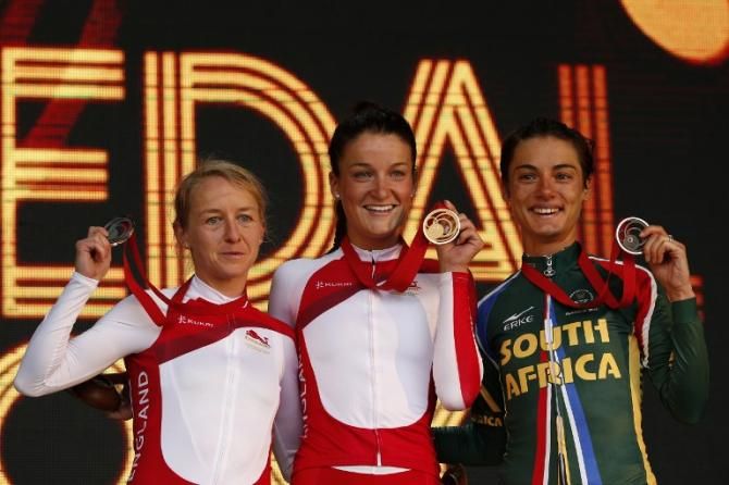 Lizzie Armitstead flanked by Emma Pooley and Ashleigh Pasio on the podium of the Commonwealth Games women's road race.
