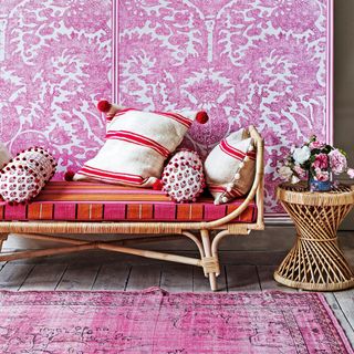 room with pink and red decor and cushion