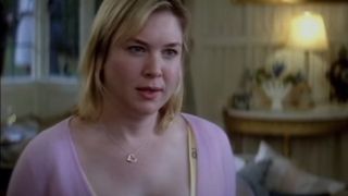 Renee Zellweger stands in a living room while in conversation in Bridget Jones: The Edge of Reason.