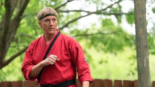 William Zabka in red kung fu attire in "Cobra Kai" season 6