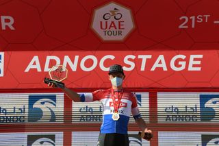ABU DHABI UNITED ARAB EMIRATES FEBRUARY 21 Podium Mathieu van der Poel of The Netherlands and Team AlpecinFenix Celebration during the 3rd UAE Tour 2021 Stage 1 a 176km stage from Al Dhafra Castle to Al Mirfa Trophy Mask Covid Safety Measures UAETour on February 21 2021 in Abu Dhabi United Arab Emirates Photo by Tim de WaeleGetty Images