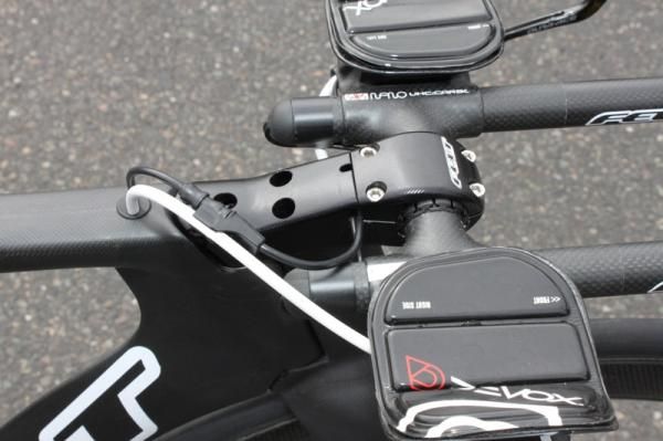The team uses custom CNC machined fixed stems, while the production version will have an adjustable rise stem.