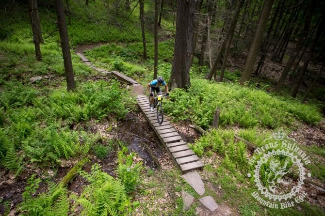 Theo Procopos crosses at Three Bridges on the last segment of the enduro stage.