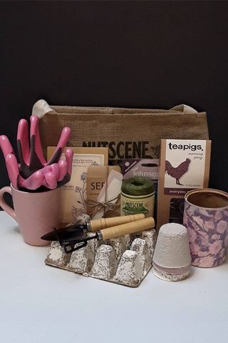 bundle of garden-related gifts including small garden tools