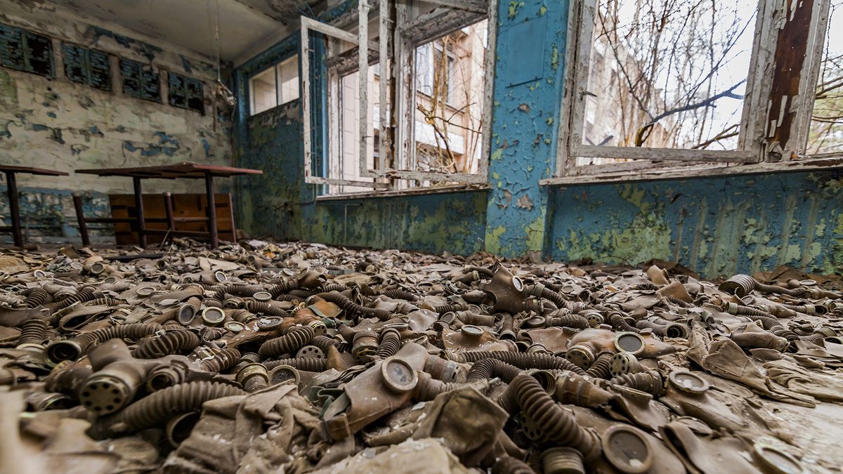 In an abandoned school in the city of Pripyat, Ukraine, the floor is littered with gas masks that were distributed after the Chernobyl disaster.