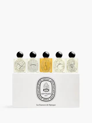 Diptyque's 5-piece set of eau de parfum features a nature-inspired bottle design in transparent glass.