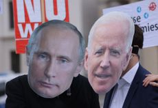Putin and Biden cardboard cutouts.