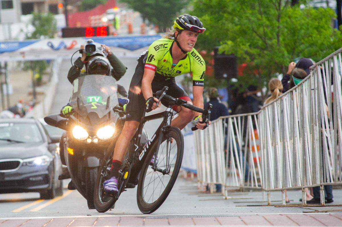 Riders take one of the slippery corners during the road race at the Winston-Salem Cycling Classic
