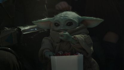 Grogu eating popcorn in The Mandalorian and Grogu