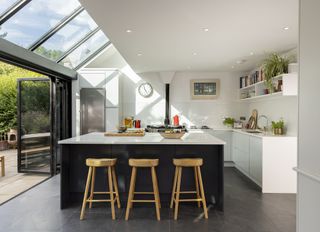 white modern kitchen with glass lean to extension