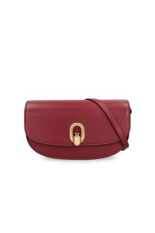 Savette burgundy The Tondo Crescent Leather Shoulder Bag on a white background