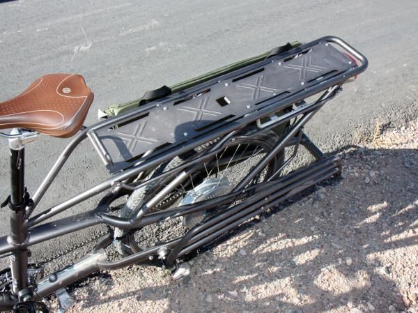When unneeded, the lower shelves of the rear rack fold up neatly against the frame.