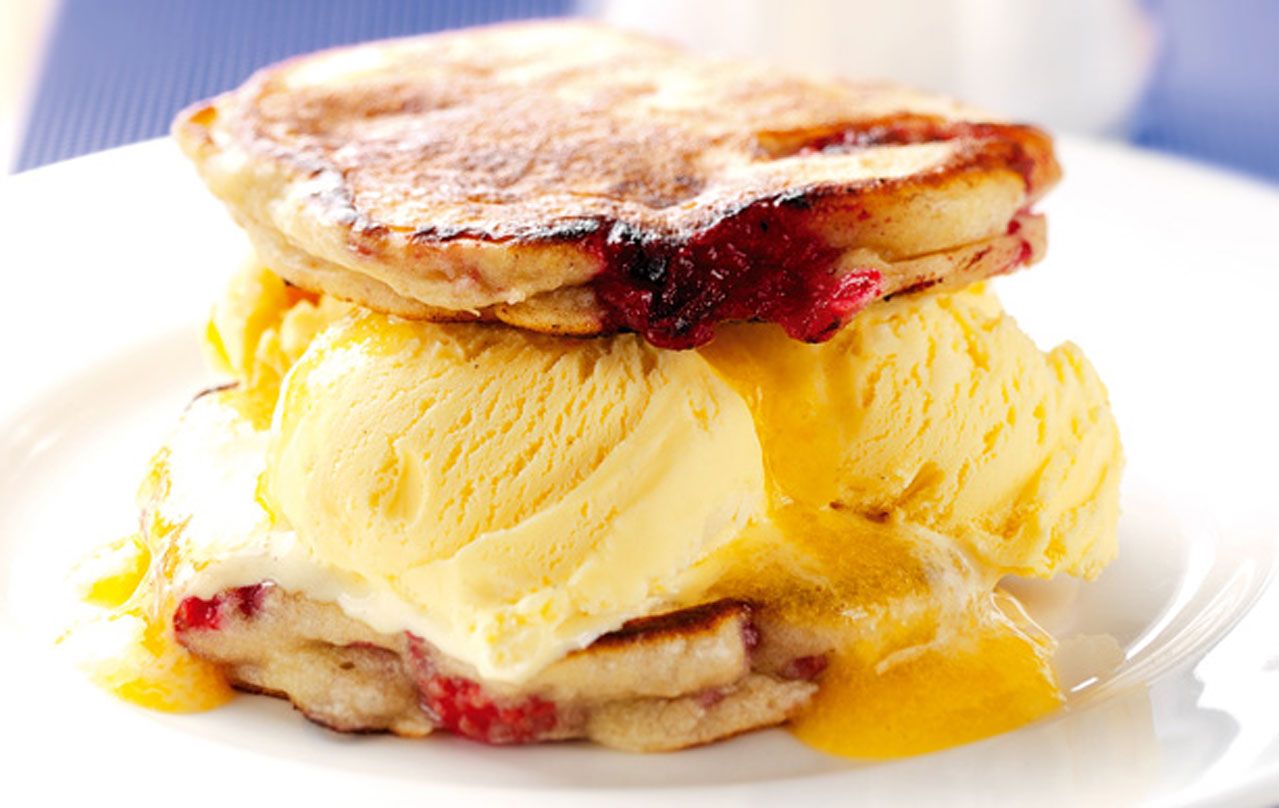 Raspberry pancakes with peach sauce