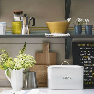 grey shelves with bread bin in kitchen