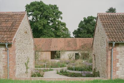 Wraxall Yard exterior with man standing at the entrance