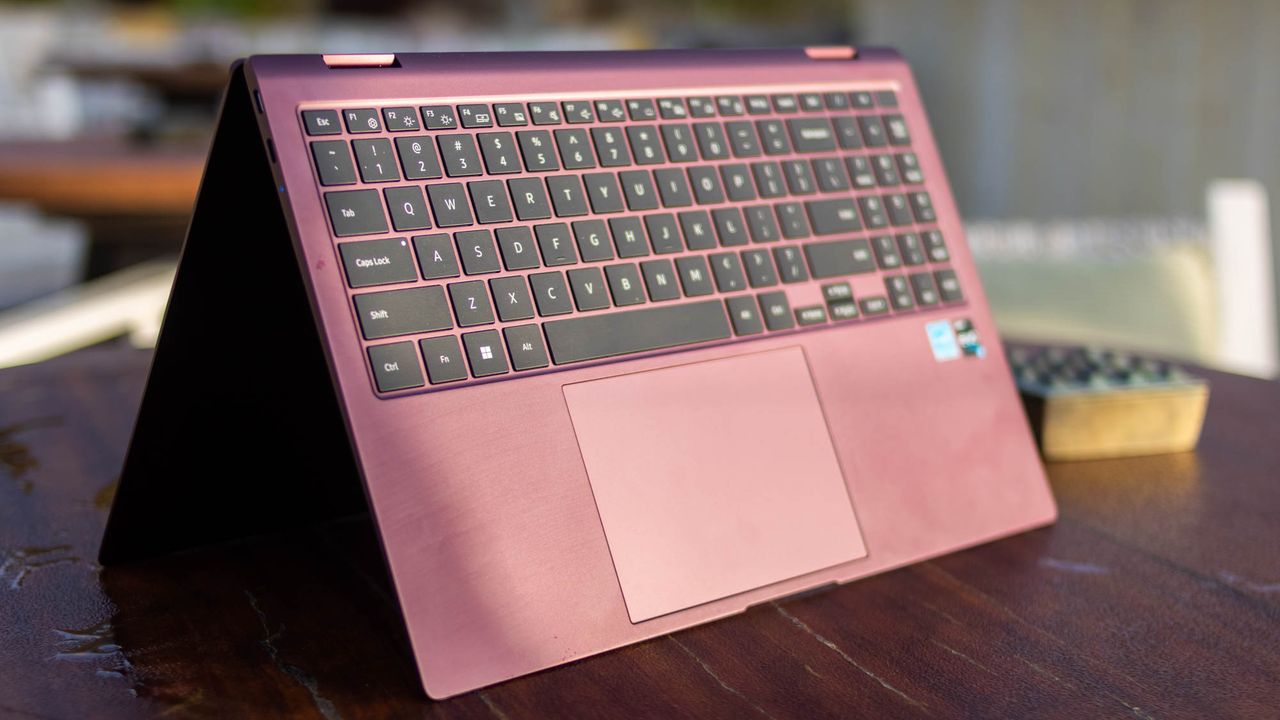 A photograph of the Samsung Galaxy Book2 Pro 360's keyboard in tent mode on a table