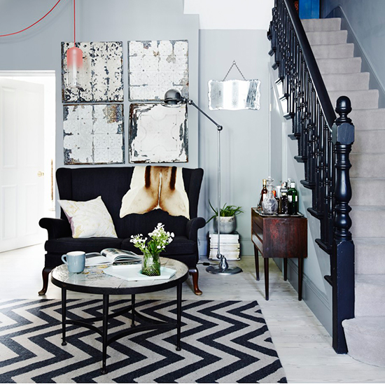 hallway with staircase cabinet floor lamp and coffee table