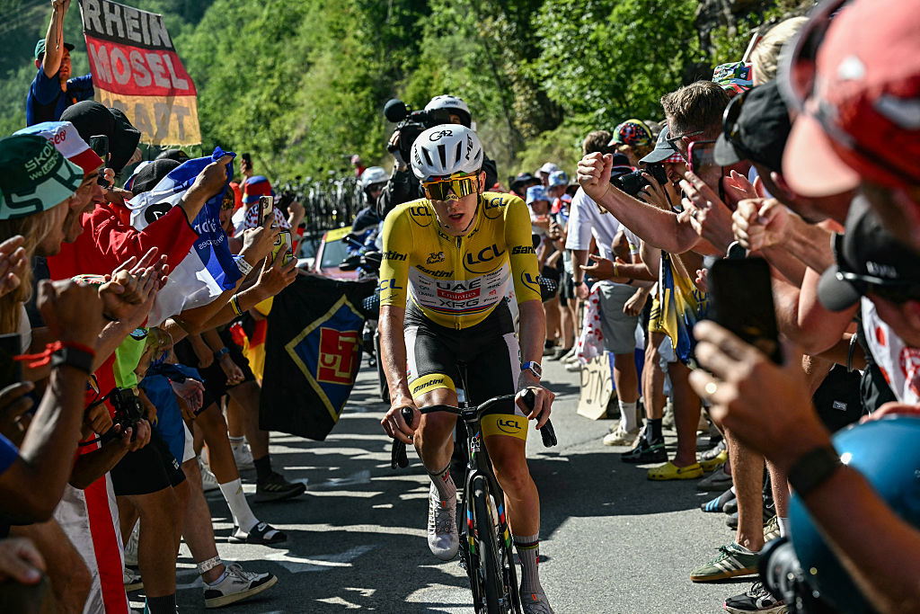 UAE Team Emirates - XRG's Slovenian rider Tadej Pogacar wearing the overall leader's yellow jersey chases down the lead breakaway group in the Alpe d'Huez ascent during the 19th stage of the 113th edition of the Tour de France cycling race, 127,9 km between Gap and Alpe d'Huez in the French Alps, on July 24, 2026. (Photo by Loic VENANCE / AFP)