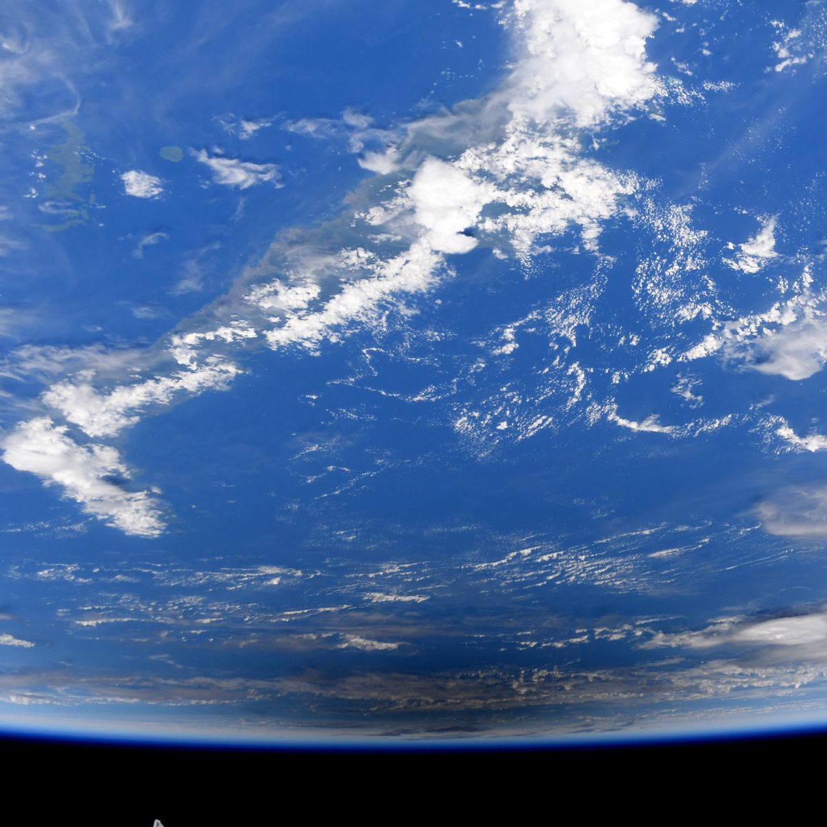 NASA astronaut Jessica Meir captured these photos of the Dec. 26, 2019 annular solar eclipse from the International Space Station. They show the moon's shadow moving across the surface of the Earth.