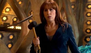 Doctor Who Donna Noble holding a rubber mallet in the TARDIS