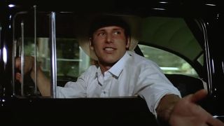 Bob Falfa (Harrison Ford) tries to goad John Milner into a race in American Graffiti