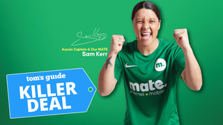 Woman cheering with green background and Tom's Guide blue badge on bottom right corner