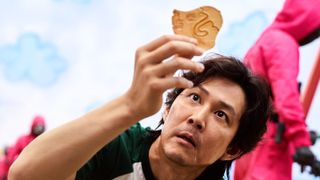 Season one of Squid Game on Netflix, here we see Seong Gi-hun (Lee Jung-jae) playing the Dalgona cookie game
