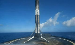 A SpaceX Falcon 9 first stage stands on the droneship A Shortfall Of Gravitas after a successful fourth landing following its launch of the Starlink 4-10 mission with 48 satellites on March 9, 2022.