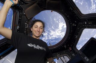 Astronaut Nicole Stott seen in the space station's cupola.