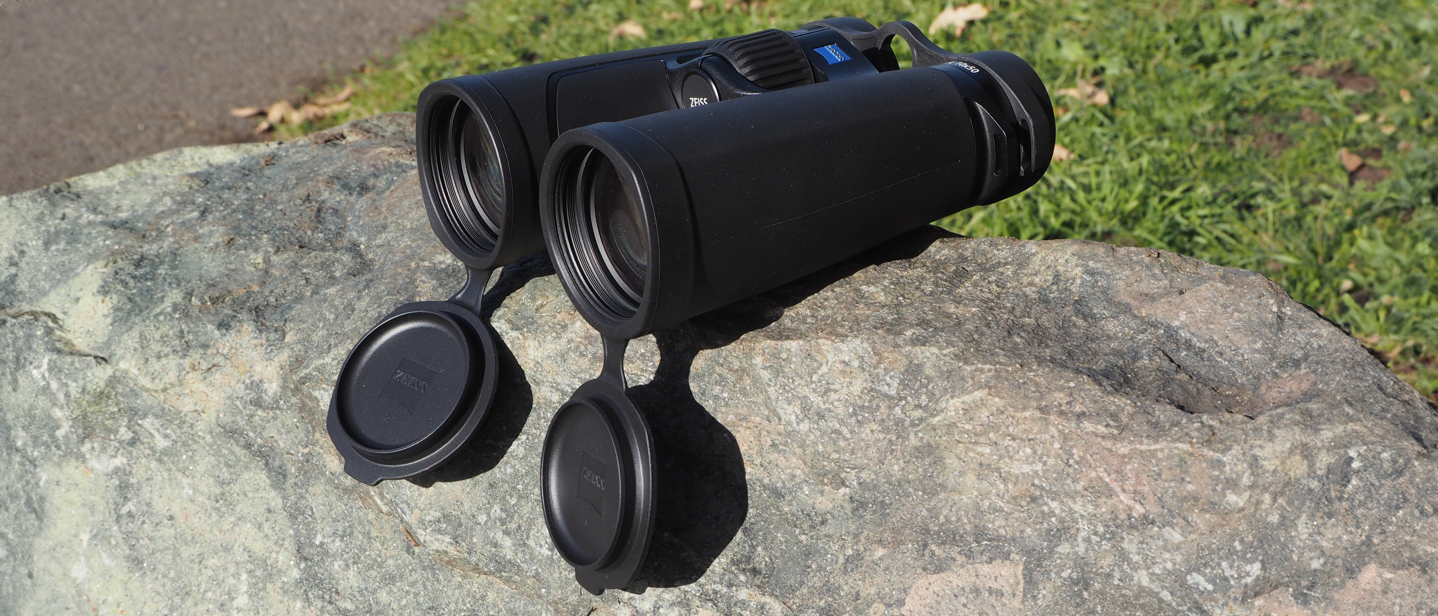 Zeiss SFL 10x50 binoculars on a rock