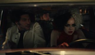 Joel Fry, Paul Walter Hauser, and Emma Stone flee in a stolen car in Cruella.