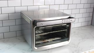 Ninja Prestige Smart XL Air Fryer & Countertop Oven being tested in a white kitchen