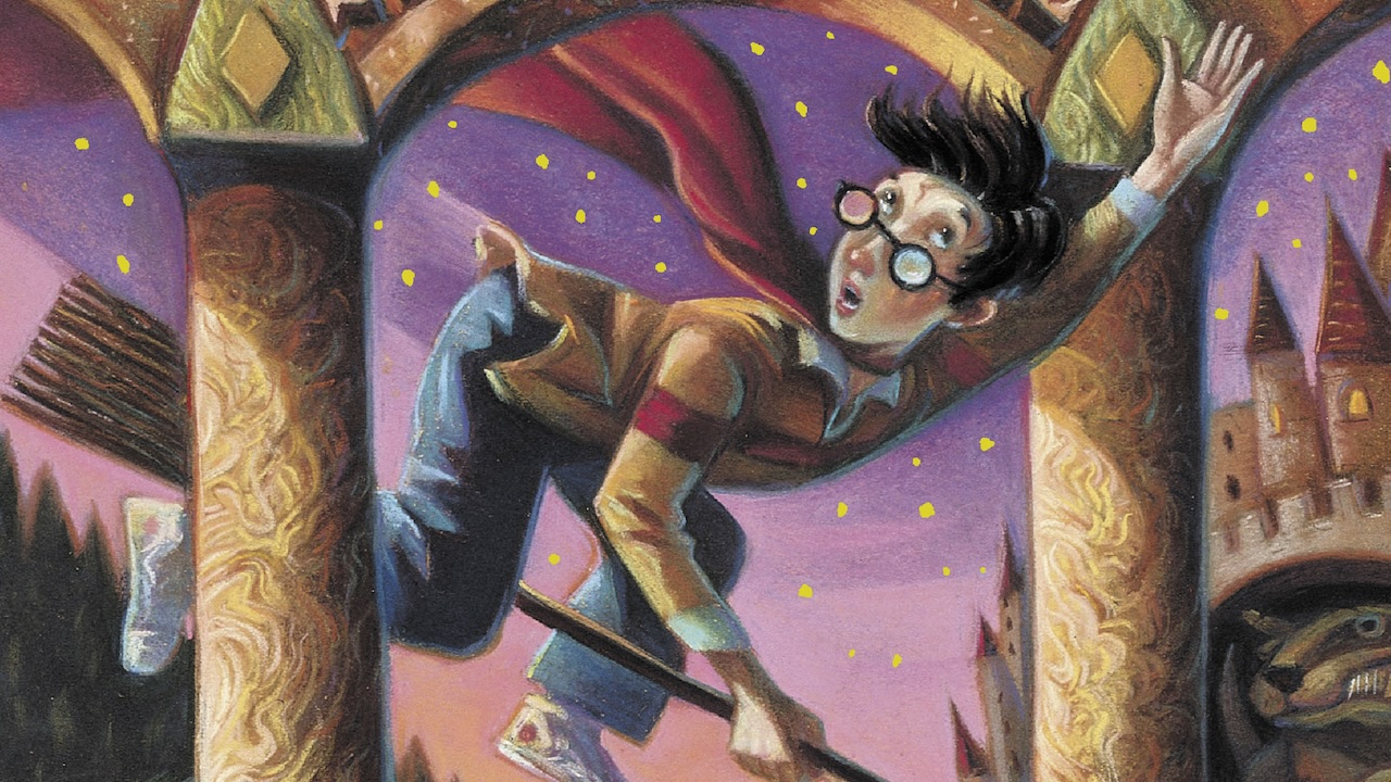 Harry Potter flying on a broom on the cover of Sorcerer's Stone