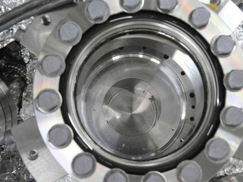 Scientists have found small particles inside the sample container of the Japanese asteroid probe Hayabusa, though it remains to be seen if they are asteroid bits or contamination from Earth. Here, particles are visible in re-entry capsule&#039;s sample contain