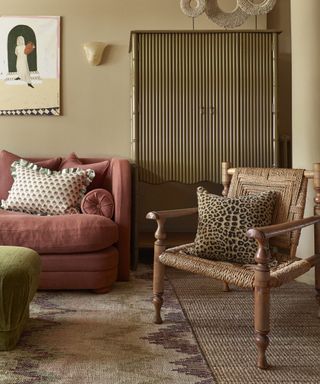 vintage living room with antique furniture and a pink couch