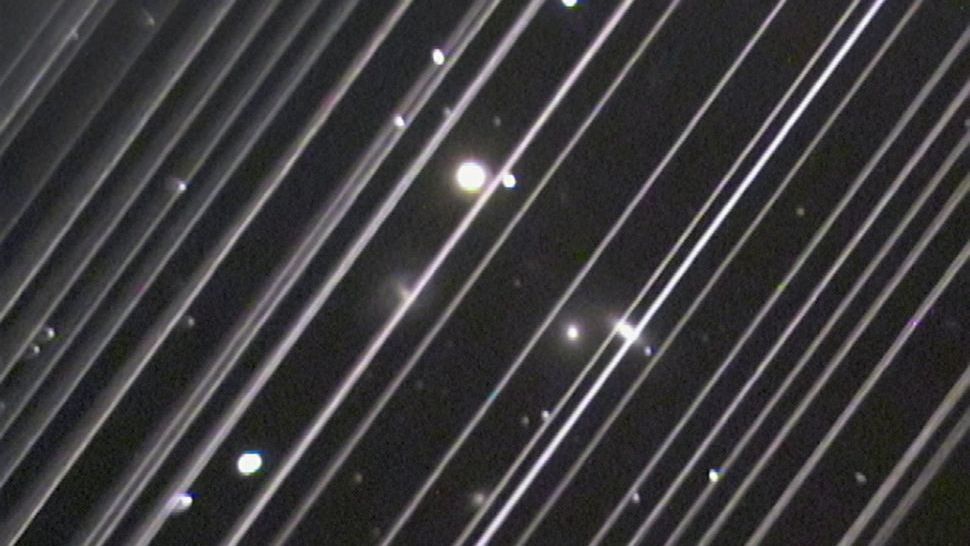 streaks of white light in front of stars