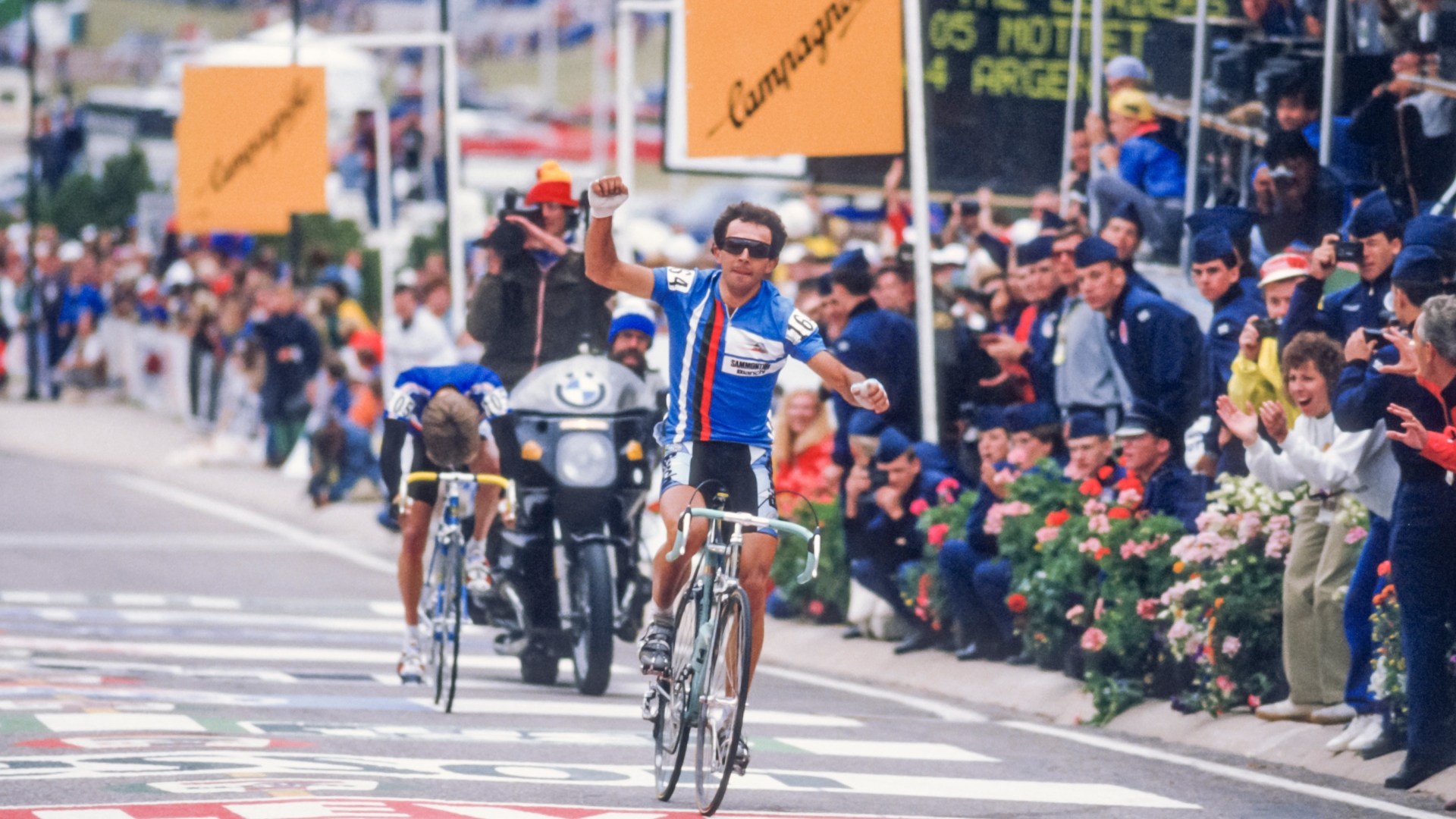 COLORADO SPRINGS, CO - SEPTEMBER 6: Moreno Argentin #164 of Italy wins the Men's Pro Road Race at the 1986 World Cycling Championship on September 6, 1986 at the United States Air Force Academy in Colorado Springs, Colorado, USA; visible finishing second is Charly Mottet of France.